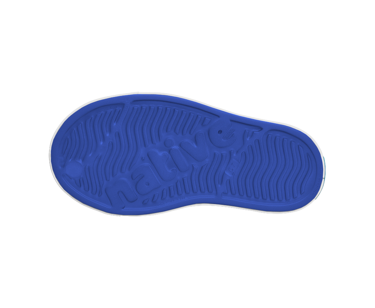 Bottom view of a Native Shoes Kids Jefferson Kids | Uv Blue / Shell White Footwear in Uv Blue / Shell White