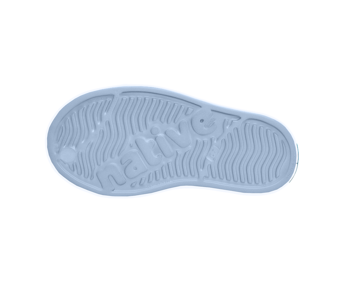 Bottom view of a Native Shoes Kids Jefferson Print Kids | Skyway Blue / Shell White / Cloud Rainbow Footwear in Skyway Blue / Shell White / Cloud Rainbow
