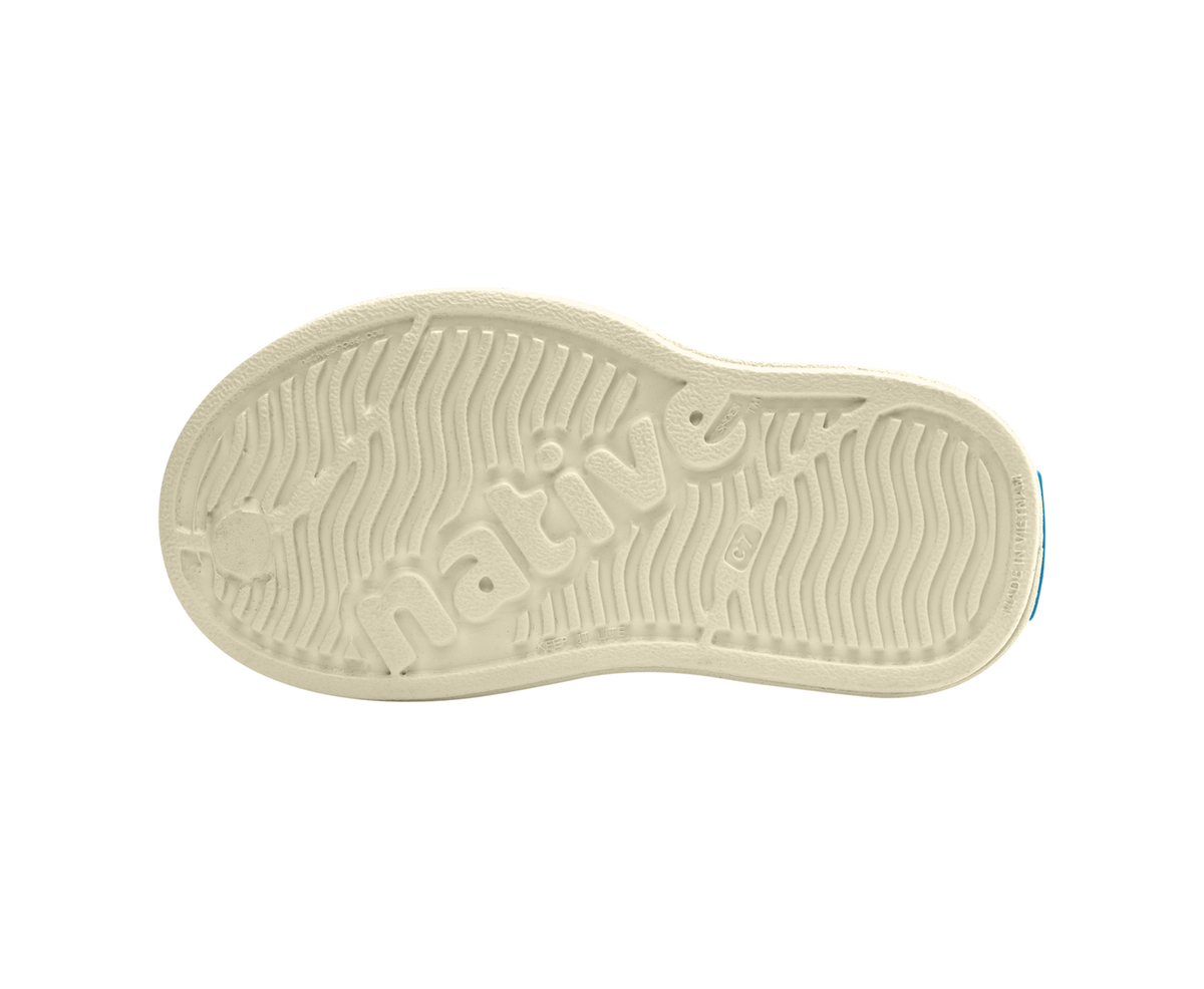 Bottom view of a Native Shoes Kids Miles Block Kids | Bone White / Shell White / Happy Flower Block Footwear in Bone White / Shell White / Happy Flower Block