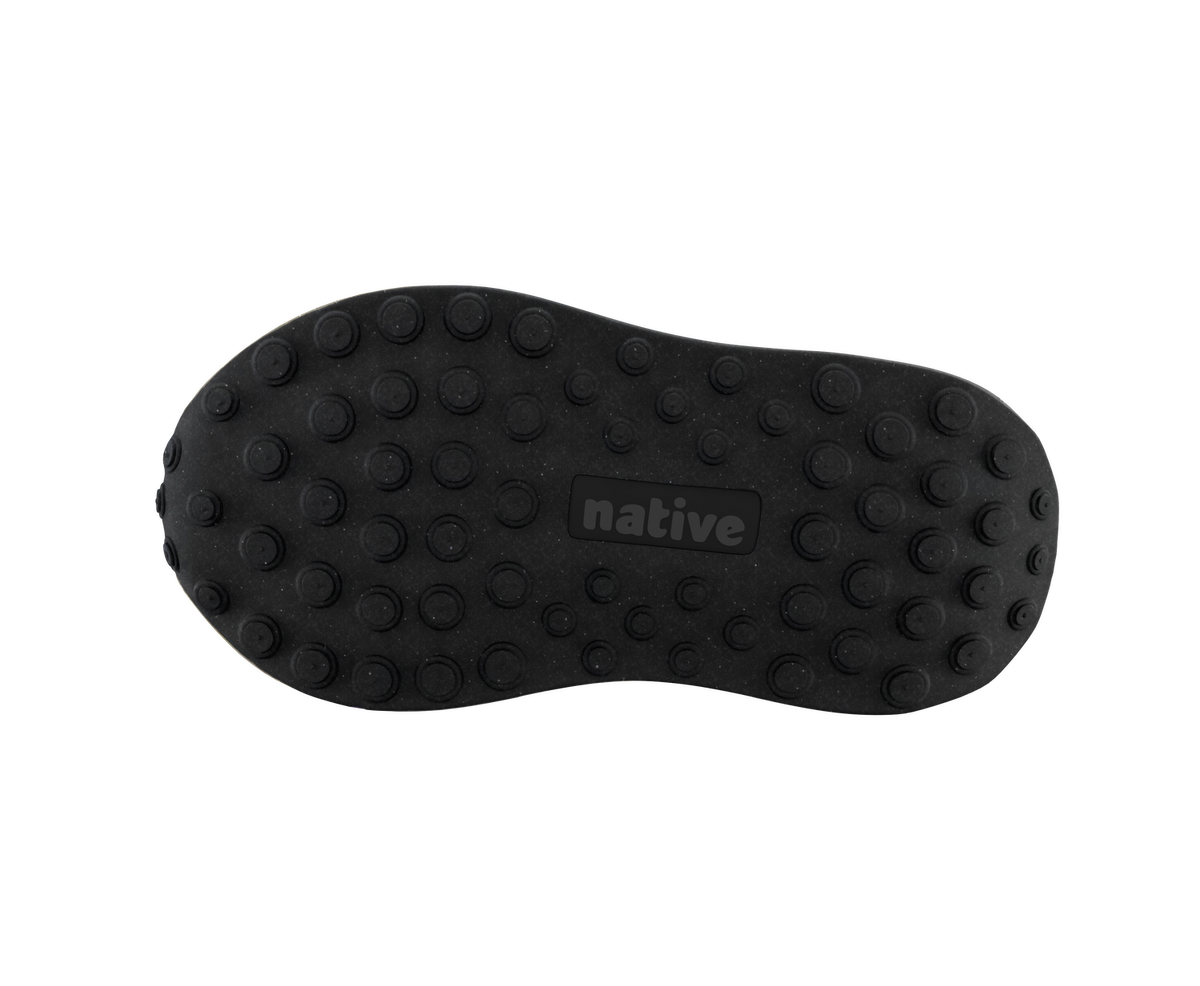 Bottom view of a Native Shoes Kids Robbie Dash Kids | Hyams Grey / Tapioca Uv / Jiffy Black Footwear in Hyams Grey / Tapioca Uv / Jiffy Black
