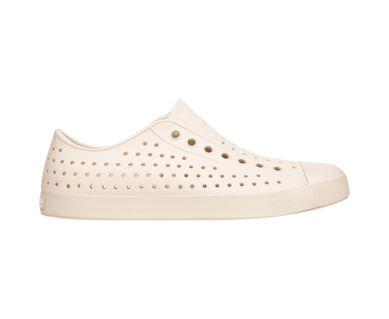 Side view of a Native Shoes Adults Jefferson Footwear in Bone White / Bone White
