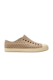 Side view of a Native Shoes Adults Jefferson Footwear in Flax Tan / Bone White