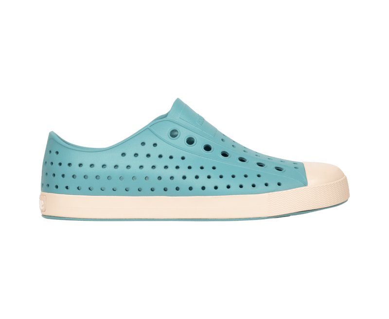 Side view of a Native Shoes Adults Jefferson Footwear in Tktbl/Bnwht