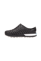 Angled view of a Native Shoes Kids Robbie Block Kids | Jfyblk/Jfyblk/Shlwht/Shlspckrb Footwear in Jfyblk/Jfyblk/Shlwht/Shlspckrb