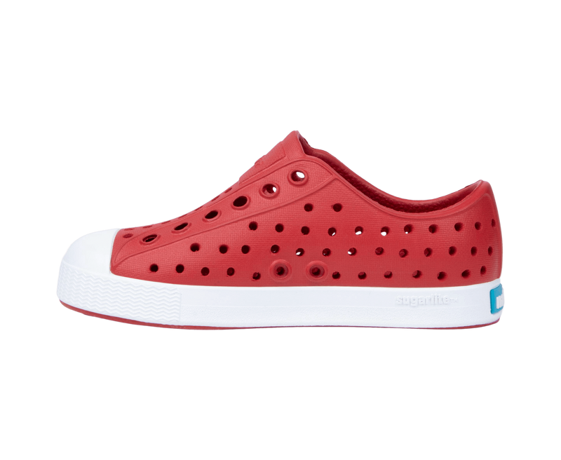 Angled view of a Native Shoes Kids Jefferson Kids | Ruby Red / Shell White Footwear in Ruby Red / Shell White