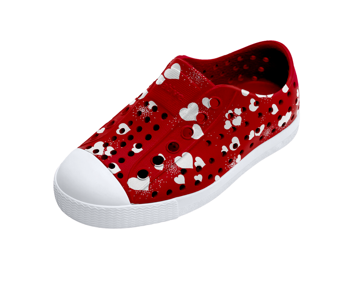 Angled view of a Native Shoes Kids Jefferson Print Kids | Ruby Red / Shell White / Heart Fireworks Footwear in Ruby Red / Shell White / Heart Fireworks