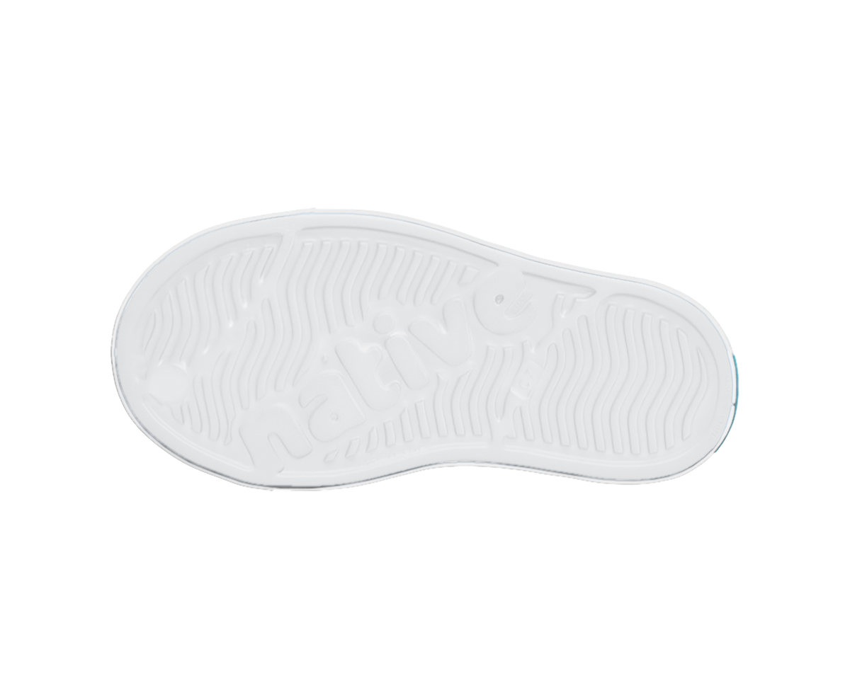 Bottom view of a Native Shoes Kids Jefferson Print Kids | Shell White / Shell White / Flux Alpine Dino Footwear in Shell White / Shell White / Flux Alpine Dino