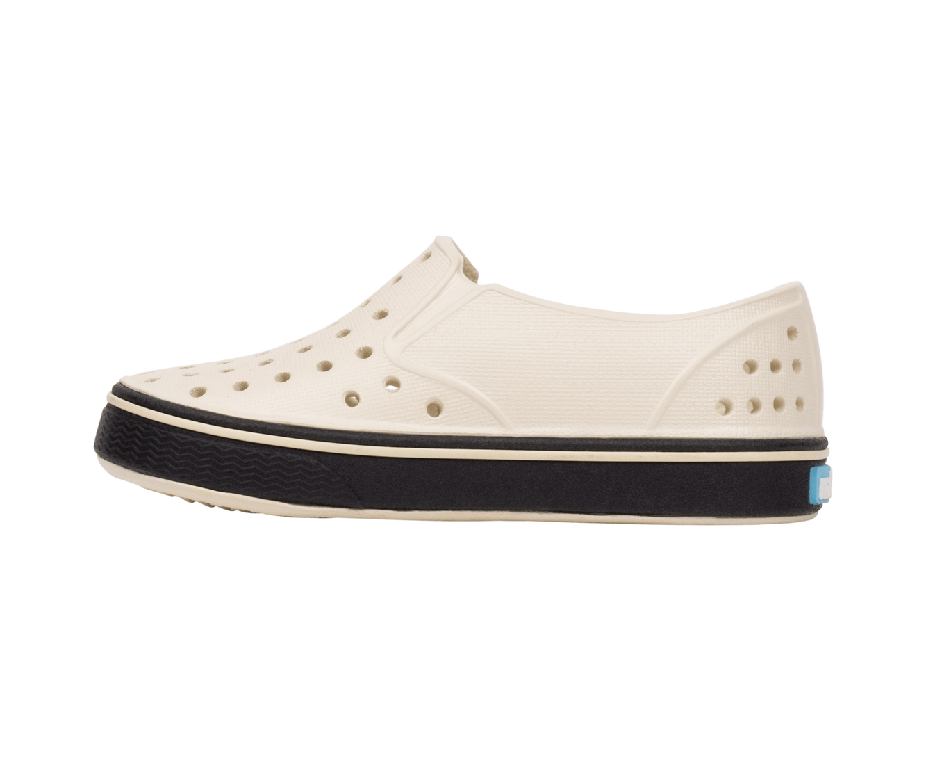 Angled view of a Native Shoes Kids Miles Kids | Bnwht/Jfyblk Footwear in Bnwht/Jfyblk