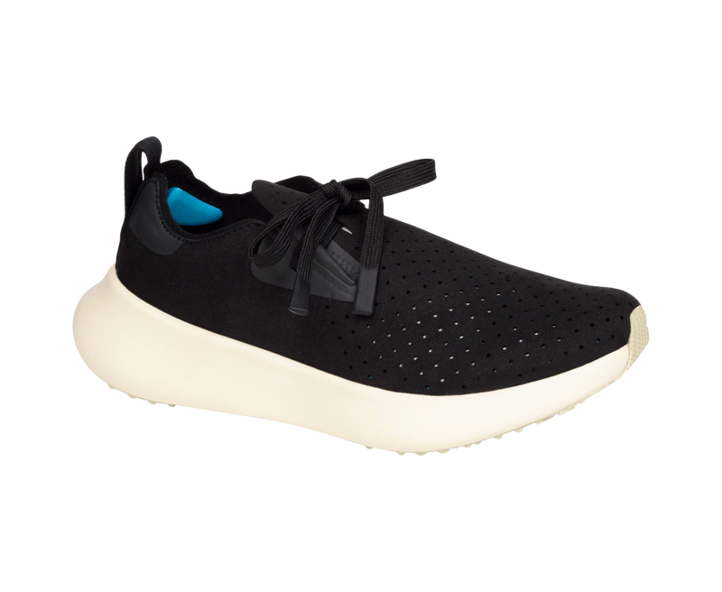 Angled view of a Native Shoes Apollo 10 | Jiffy Black / Tapioca Off White Footwear in Jiffy Black / Tapioca Off White