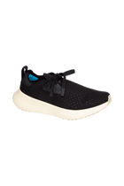 Angled view of a Native Shoes Apollo 10 | Jiffy Black / Tapioca Off White Footwear in Jiffy Black / Tapioca Off White