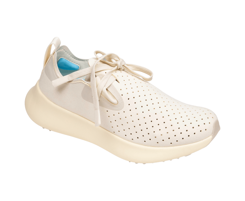 Angled view of a Native Shoes Apollo 10 | Bone White / Tapioca Off White Footwear in Bone White / Tapioca Off White