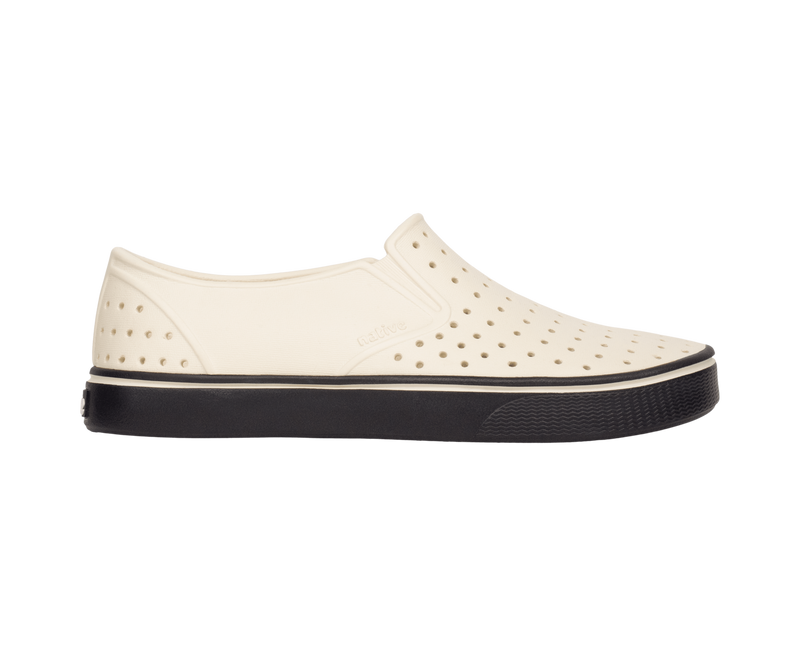 Side view of a Native Shoes Adults Miles Wanderfoam Footwear in Bnwht/Jfyblk