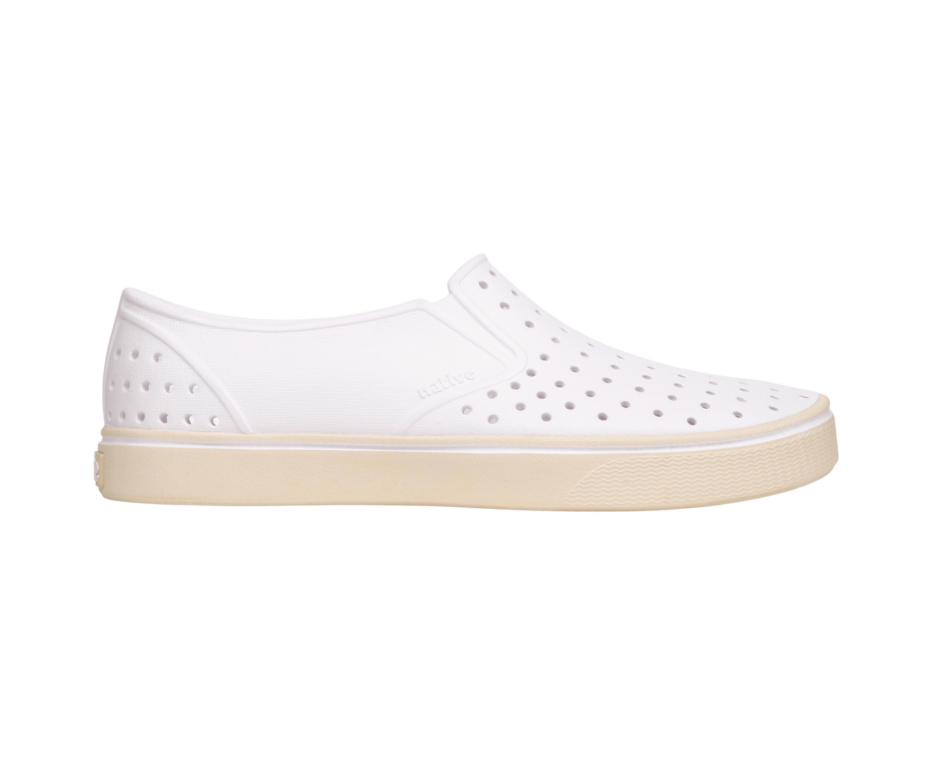 Side view of a Native Shoes Adults Miles Wanderfoam Footwear in Shell White / Bone White