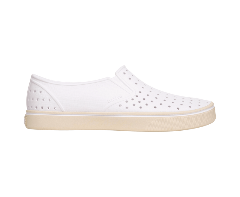 Side view of a Native Shoes Adults Miles Wanderfoam Footwear in Shell White / Bone White