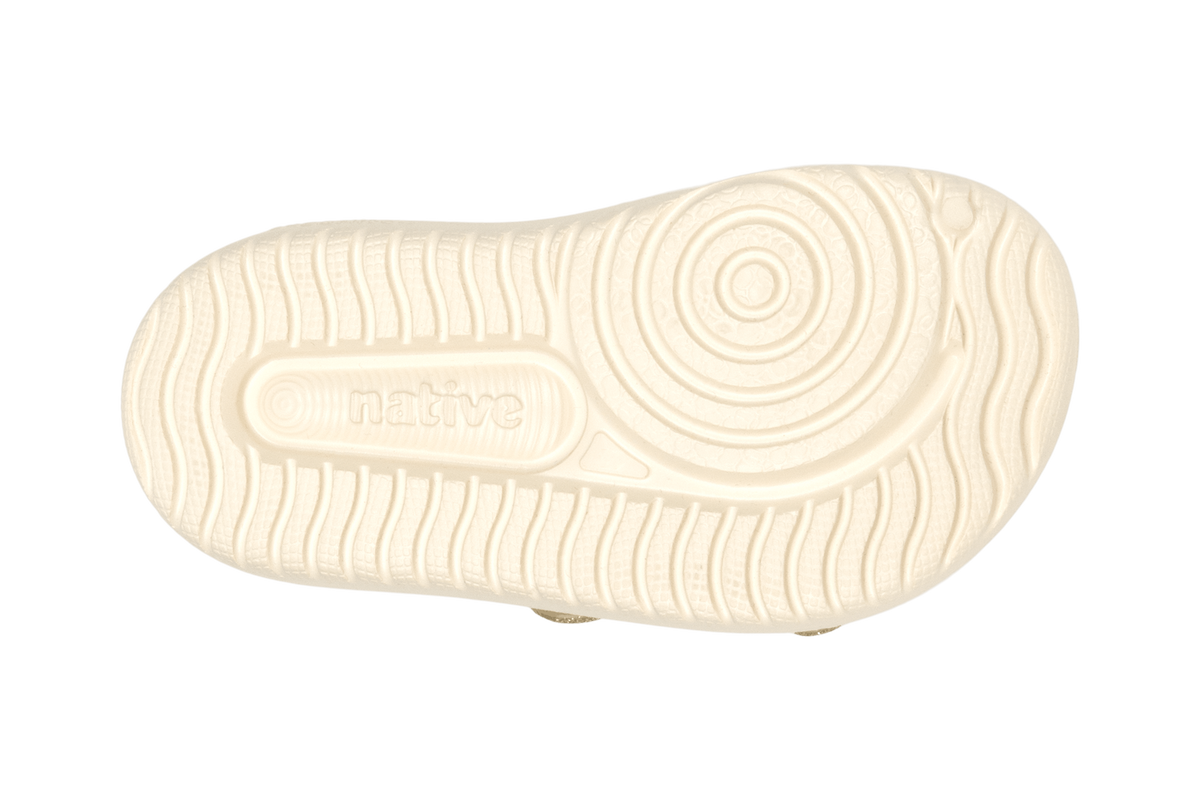 Bottom view of a Native Shoes Kids Chase Bio-Bling Kids | Taos Tan Bling / Bone White Footwear in Taos Tan Bling / Bone White