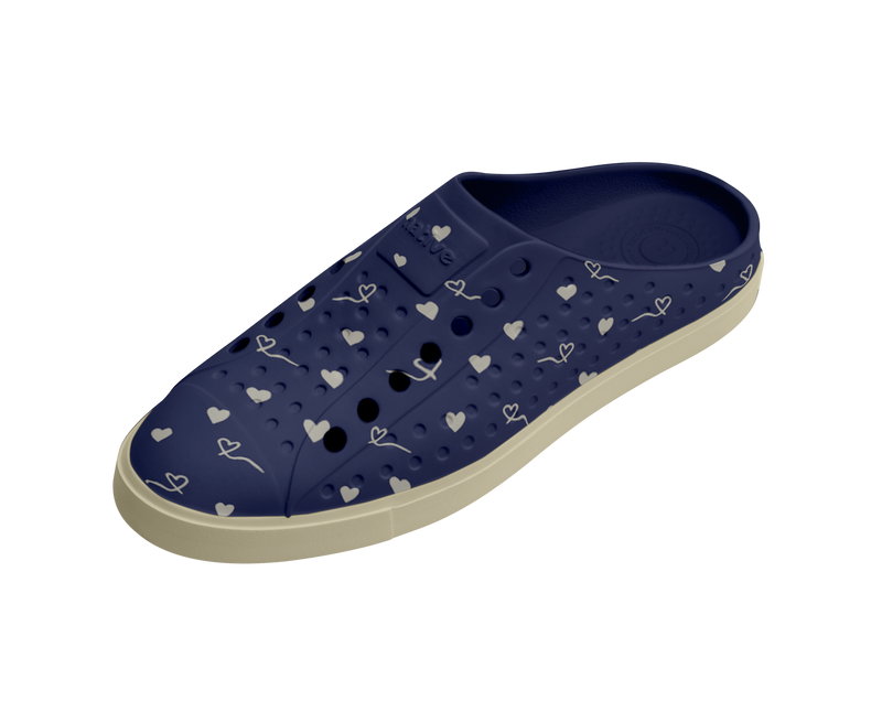Angled view of a Native Shoes Jefferson Clog Wanderfoam Prnt | Bone White / Bone White / Regatta Hearts Footwear in Bone White / Bone White / Regatta Hearts