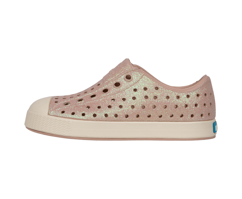 Angled view of a Native Shoes Kids Jefferson Bio-Bling Kids | Chameleon Pink Bling / Bone White Footwear in Chameleon Pink Bling / Bone White