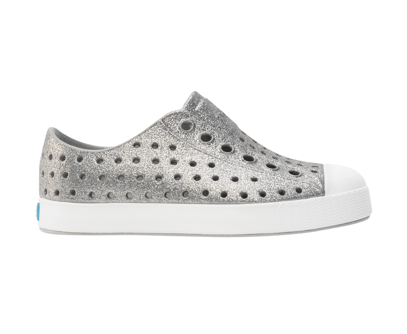 Side view of a Native Shoes Kids Jefferson Bio-Bling Kids Footwear in Platinum Bling / Shell White