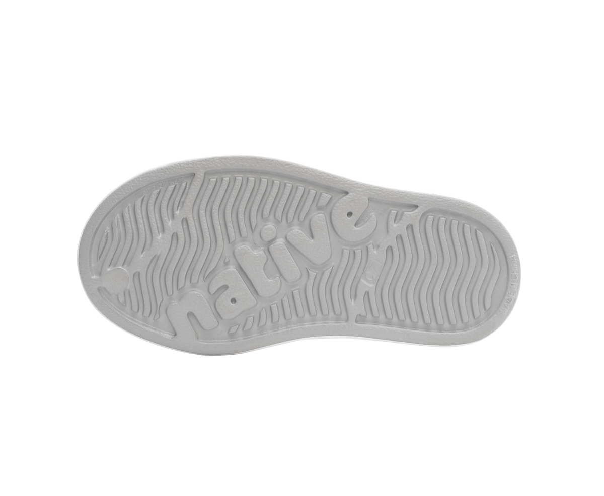 Bottom view of a Native Shoes Kids Jefferson Bio-Bling Kids | Platinum Bling / Shell White Footwear in Platinum Bling / Shell White