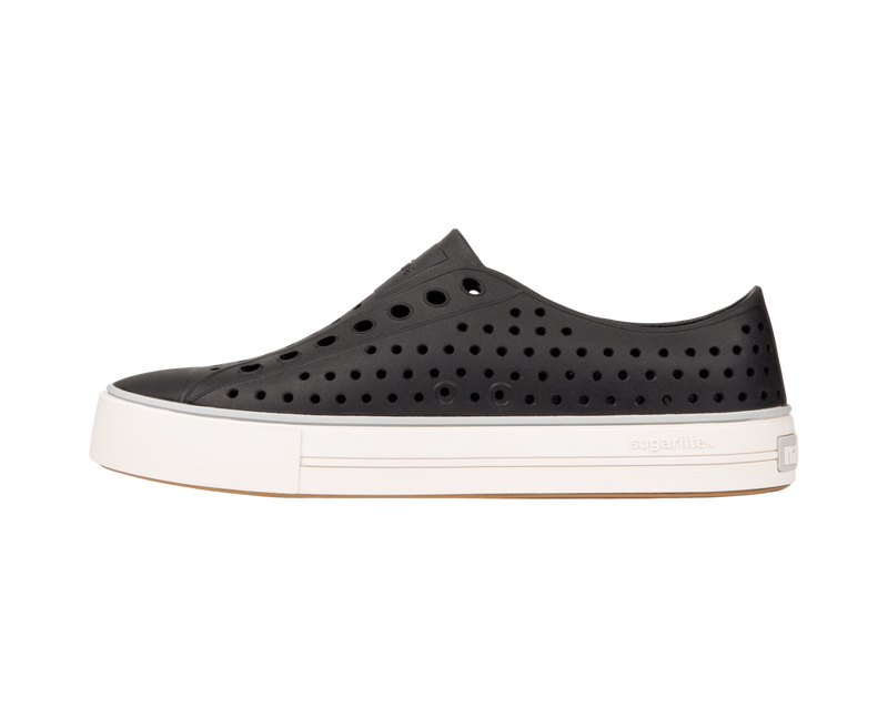 Angled view of a Native Shoes Jefferson Arc Wanderfoam | Jiffy Black / Whisper White Footwear in Jiffy Black / Whisper White