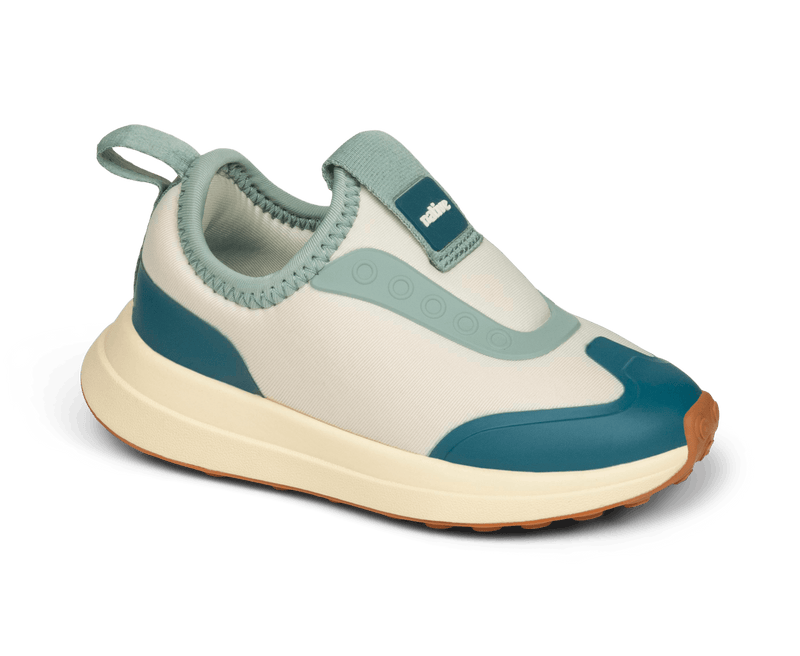 Angled view of a Native Shoes Kids Robbie Dash Kids | Bone White / Tapioca Off White / Hazel Brown Footwear in Bone White / Tapioca Off White / Hazel Brown