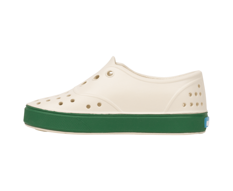 Angled view of a Native Shoes Kids Miller Kids | Bnwht/Hntrgr Footwear in Bnwht/Hntrgr